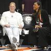 Las Vegas Aces owner Mark Davis, left, speaks with Aces president Nikki Fargas before Game 4 of a WNBA basketball final playoff series, Sunday, Sept. 18, 2022, in Uncasville, Conn.