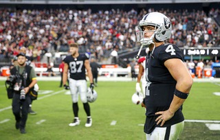 Las Vegas Raiders quarterback Derek Carr (4) stands in the field after the Raiders 29-23 overtime loss to the Arizona Cardinals in an NFL football game at Allegiant Stadium Sunday, Sept. 18, 2022, in Las Vegas. 