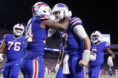 Buffalo Bills’ Stefon Diggs, second from left, celebrates with quarterback Josh Allen, second from right, after they connected for a touchdown during the second half of an NFL football game against the Tennessee Titans, Monday, Sept. 19, 2022, in Orchard Park, N.Y. 


