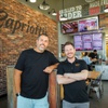 Ashley Morris, left, and Jason Smylie are co-owners of the Capriotti’s chain of sandwich shops. 
