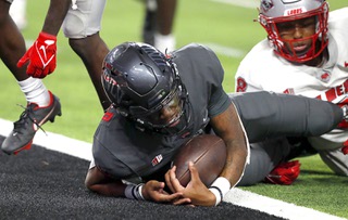 UNLV Rebels quarterback Doug Brumfield (2) scores a touchdown during the second half of an NCAA football game against the New Mexico Lobos at Allegiant Stadium Friday, Sept. 30, 2022.