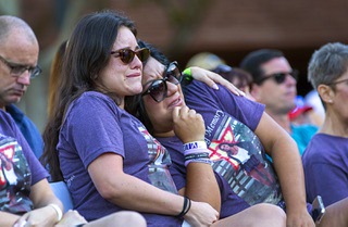 Olivia Ramirez, left, and Kandis Gumbs, cousins of Christiana Duarte, attend a Sunrise Remembrance Ceremony, honoring victims of the Oct. 1, 2017 mass shooting, at the Clark County Government Ceremony Saturday, Oct. 1, 2022. Duarte, of Torrance, Calif., was one of the victims killed in the Oct. 1 mass shooting.