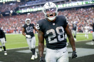Las Vegas Raiders running back Josh Jacobs (28) celebrates after scoring a touchdown during an NFL football game against the Denver Broncos at Allegiant Stadium Sunday, Oct. 2, 2022. STEVE MARCUS