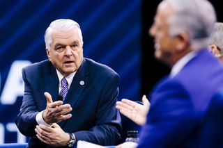 Nevada Democratic Governor Steve Sisolak addresses Nevada Republican candidate for governor Joe Lombardo during a debate at IndyFest in Las Vegas, Sunday, Oct. 2, 2022.