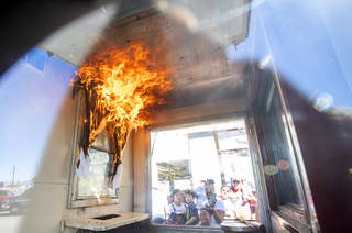 Sprinklers put out a curtain fire in a demonstration organized by the Sprinkler Fitters Union, Local 669, during an open house at Las Vegas Fire Station 3 Saturday, Oct. 8, 2022. The event was a kick-off to celebrate the 100th anniversary of National Fire Prevention Week.