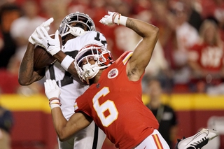 Las Vegas Raiders wide receiver Davante Adams, left, catches a 48-yard touchdown pass as Kansas City Chiefs safety Bryan Cook (6) defends during the second half Monday, Oct. 10, 2022, in Kansas City, Mo. 


