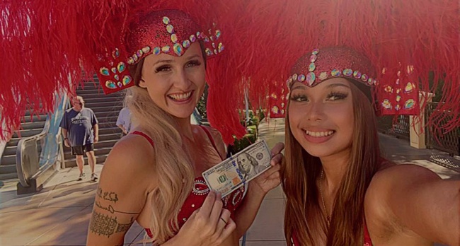 Showgirls Maris DiGiovanni, left, and Victoria Cayetano pose for a selfie on the Las Vegas Strip. DiGiovanni was killed and Cayetano wounded in the Oct. 6 attack.