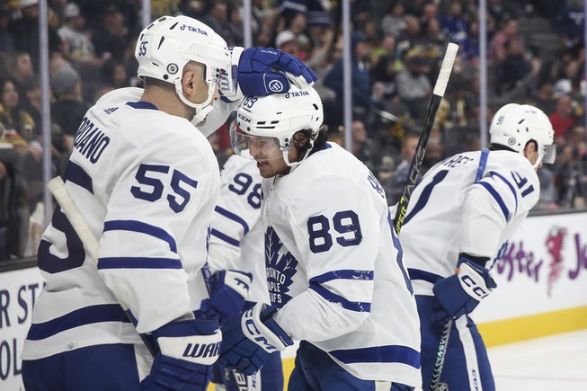 Toronto Maple Leafs defenseman Mark Giordano (55) celebrates a goal by left wing Nicholas Robertson (89) during the second period of an NHL hockey game against the Vegas Golden Knights at T-Mobile Arena Monday, Oct. 24, 2022. The Vegas Golden Knights beat Toronto Maple Leafs 3-1.