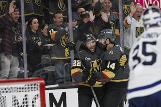 Vegas Golden Knights center Michael Amadio (22) celebrates with defenseman Nicolas Hague (14) after scoring against the Toronto Maple Leafs during the third period of an NHL hockey game at T-Mobile Arena Monday, Oct. 24, 2022. Vegas beat Toronto 3-1.