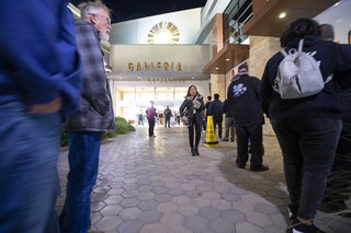 A line of voters snakes outside the Galleria at Sunset shopping mall in Henderson, Nev. Tuesday, Nov. 8, 2022. Voters leaving the mall were reporting wait times of 90 minutes to two hours.
