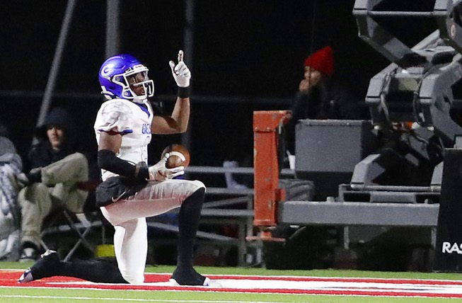 Bishop Gorman defensive back Jeremiah Hughes (6) celebrates after making an interception and taking the ball into the Liberty end zone for a touchdown during the Class 5A Southern Region final at Liberty High School in Henderson, Friday, Nov. 11, 2022.
