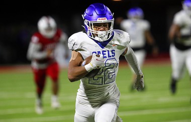Bishop Gorman running back Micah Kaapana (22) runs for a touchdown against Liberty during the Class 5A Southern Region final at Liberty High School in Henderson, Friday, Nov. 11, 2022.