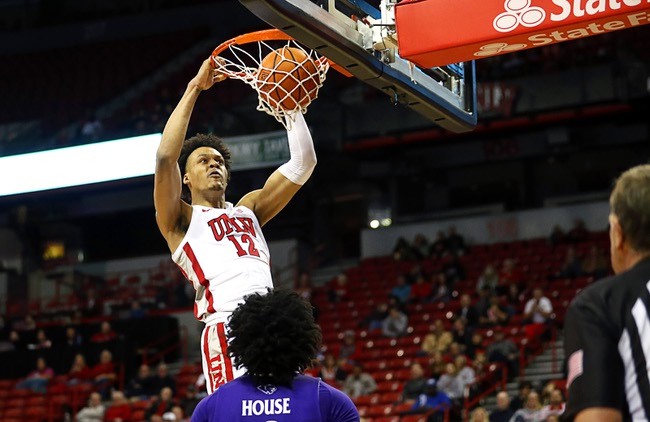 UNLV Rebels center David Muoka (12) dunks against the High Point Panthers during the second half of an NCAA basketball game at the Thomas & Mack Center Friday, Nov. 18, 2022.