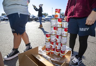 Cans of soup are stacked during a Just One Project food distribution event at Clark High School Saturday, Nov. 19, 2022. Volunteers included members of the Clark High School Junior ROTC programs, West Tech National Honor Society members, National Junior Honor Society members from Sig Roguish Union High, United Parcel Service, Rainbow Praise Church and Destiny Christian Center.