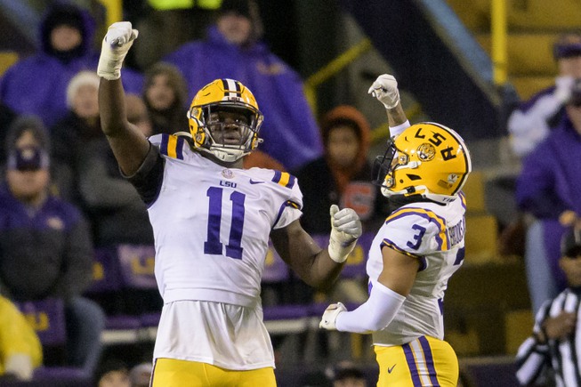 LSU defensive end Ali Gaye (11) celebrates a sack of UAB quarterback Dylan Hopkins with safety Greg Brooks Jr. (3) during the first half of an NCAA college football game in Baton Rouge, La., Saturday, Nov. 19, 2022. 


