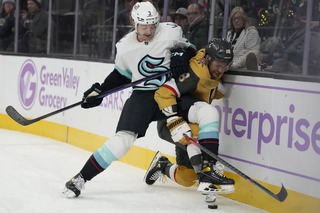 Seattle Kraken defenseman Will Borgen and Vegas Golden Knights left wing William Carrier battle for the puck during the second period Friday, Nov. 25, 2022, in Las Vegas. 


