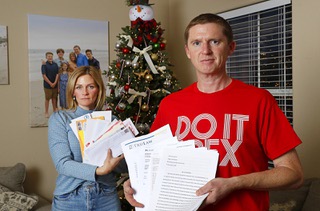 Samantha and Jason Patchett, parents of Rex Patchett, pose with letters at their home in Henderson Thursday, Dec. 1, 2022. Rex Patchett, 13, was killed by a motorist who lost control of his car on March 7, 2022. Jose Marmolejo, 21, pled guilty to a reckless driving charge and is expected to be sentenced on Jan. 25, 2023. The letters will be presented to the judge before sentencing.