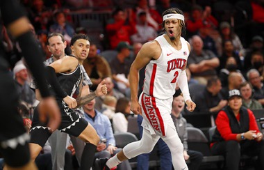 UNLV Rebels guard Justin Webster (2) celebrates after sinking a three-point basket during the first half of an NCAA basketball game against the Hawaii Warriors at The Dollar Loan Center in Henderson Wednesday, Dec. 7, 2022.