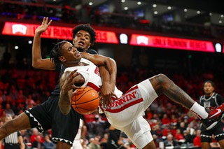 UNLV Rebels guard Luis Rodriguez (15) is fouled by Hawaii Warriors forward Bernardo da Silva (5) during the second half of an NCAA basketball game at The Dollar Loan Center in Henderson Wednesday, Dec. 7, 2022.