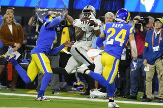 Las Vegas Raiders wide receiver Davante Adams makes a catch as Los Angeles Rams cornerback Jalen Ramsey, left, and safety Taylor Rapp defend during the first half Thursday, Dec. 8, 2022, in Inglewood, Calif. 


