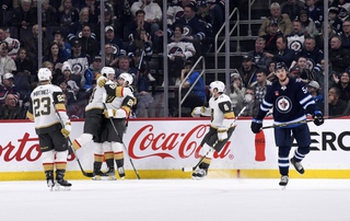Vegas Golden Knights' Mark Stone (61) celebrates his goal against the Winnipeg Jets with Chandler Stephenson (20), Alec Martinez (23) and Phil Kessel (8) during the second period in Winnipeg, Manitoba on Tuesday, Dec. 13, 2022. 


