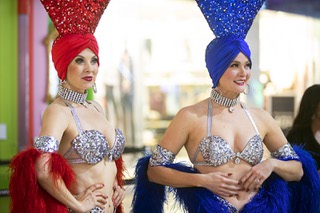 Showgirls Jennifer Autry, left, and Tara Taylor prepare for an America's Party 2023 news conference at the Fashion Show mall Thursday, Dec. 15, 2022.