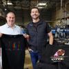 Mario Stadtlander, president, left, and Sean Ono, CEO, pose on the shop floor at Eagle Promotions, a custom apparel and promotional items company, Friday, Dec. 16, 2022. The company is one of the local companies accepted in the NFL Business Connect program.