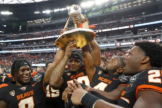 Oregon State Beavers celebrates with the trophy after Oregon State beat Florida Gators, 30-3, in the SRS Distribution Vegas Bowl at Allegiant Stadium Saturday, Dec. 17, 2022.