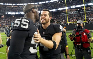 Las Vegas Raiders quarterback Derek Carr (4) celebrates with defensive end Chandler Jones (55) after a 30-24 win over the New England Patriots in an NFL football game at Allegiant Stadium Sunday, Dec. 17, 2022. Jones scored the winning touchdown on the games final play.