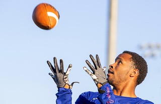 Wide receiver Devion Clayton catches a pass during a workout at All American Park Wednesday, Dec. 21, 2022.