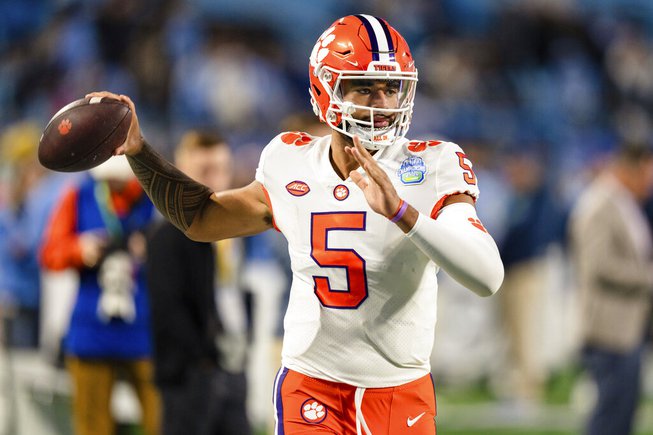 Clemson quarterback DJ Uiagalelei warms up before the Atlantic Coast Conference championship NCAA college football game against North Carolina on Saturday, Dec. 3, 2022, in Charlotte, N.C. 

