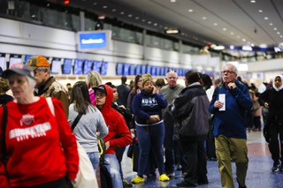 People wait in the Southwest ticketing line at Harry Reid International Airport Tuesday, Dec. 27, 2022.