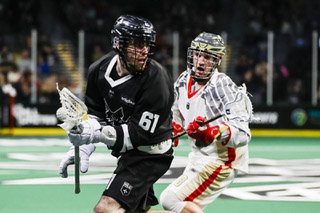Las Vegas Desert Dogs forward Charlie Bertrand (61) carries the ball as Philadelphia Wings defender Steph Charbonneau (18) chases after him during the second half of a NLL lacrosse game at the Michelob Ultra Arena Friday, Jan. 6, 2023.