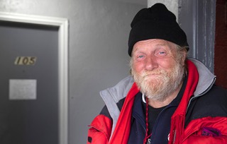 Christopher Jaynes, a homeless man, poses outside his motel room in Henderson Thursday, Jan. 12, 2023. HELP of Southern Nevada arranged for the motel room for Jaynes.
