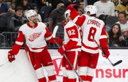 Detroit Red Wings center Joe Veleno, left, celebrates with teammates Jordan Oesterle (82) and Ben Chiarot (8) after scoring against the Vegas Golden Knights during the second period of an NHL hockey game at T-Mobile Arena Thursday, Jan. 19, 2023.