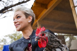 Linzy Stahl holds a Splash Marans hen near her backyard chicken coop Thursday, Jan. 19, 2023.