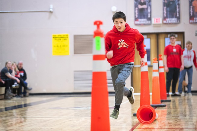 Brekken Miller competes in a relay course during a pep rally in the school gym at Tonopah High School in Tonopah, Nev. Thursday, Jan. 26, 2022.
