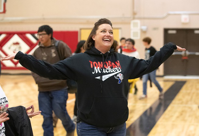 Principal Melinda Jeffrey gestures to students during a pep rally in the school gym at Tonopah High School in Tonopah, Nev. Thursday, Jan. 26, 2022.