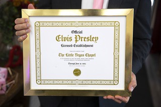 Michael Kelly, managing partner at Little Vegas Chapel, holds an Elvis wedding licensing certificate at the chapel, East Imperial Avenue and Third Street, Thursday, Feb. 2, 2023.
