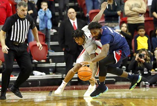 Fresno State Bulldogs guard Jordan Campbell (5) steals the ball from UNLV Rebels guard Keshon Gilbert (10) in the final seconds of an NCAA basketball game Friday, Feb. 3, 2023, in Las Vegas.