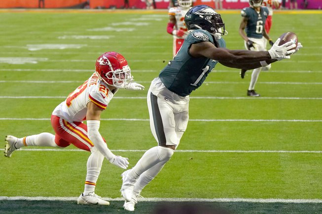 Philadelphia Eagles wide receiver A.J. Brown (11) makes the touchdown catch against Kansas City Chiefs cornerback Trent McDuffie (21) during the first half of the NFL Super Bowl 57 football game between the Kansas City Chiefs and the Philadelphia Eagles, Sunday, Feb. 12, 2023, in Glendale, Ariz. 