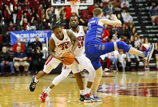 UNLV Rebels guard Jackie Johnson III (24) steals a pass intended for Air Force Falcons guard Jake Heidbreder (3) during the final seconds of an NCAA basketball game Friday, Feb. 24, 2023, in Las Vegas. UNLV Rebels guard EJ Harkless (55) made a basket with 1.8 seconds left to put UNLV ahead.