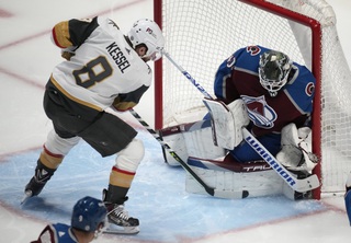 Colorado Avalanche goaltender Alexandar Georgiev, right, makes a stic-save against a shot by Vegas Golden Knights right wing Phil Kessel (8) in the first period of an NHL hockey game Monday, Feb. 27, 2023, in Denver. 


