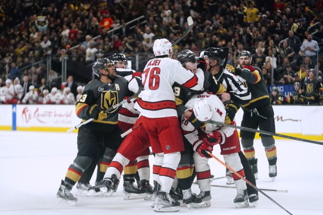 Vegas Golden Knights and Carolina Hurricanes fight during the second period Wednesday, March 1, 2023, in Las Vegas. 


