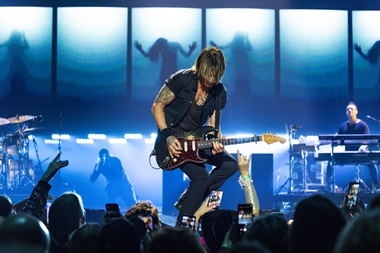 Who could sit while Keith Urban, the four-time Grammy Award-winning singer, songwriter and guitarist extraordinaire, and his band pounded out hit after high-energy hit during the nearly two-hour sold-out show?