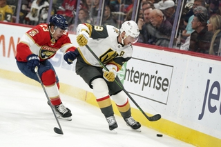 Vegas Golden Knights right wing Reilly Smith (19) and Florida Panthers center Carter Verhaeghe (23) battle for the puck during the first period Tuesday, March 7, 2023, in Sunrise, Fla. 


