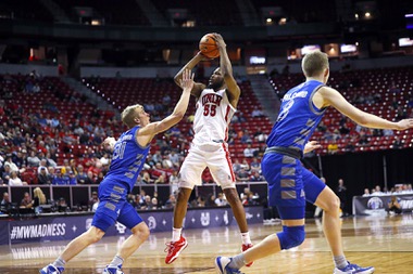 UNLV Rebels guard EJ Harkless (55) takes a shot over Air Force Falcons forward Rytis Petraitis (31) in the second half of an NCAA basketball game during the Mountain West tournament at the Thomas & Mack Center Wednesday, March 8, 2023.