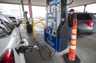 Motorists fill their cars with gasoline at a Sams Club in Bullhead City, Ariz., across the river from Laughlin, Nev., Tuesday, March 21, 2023. The price for regular gasoline at Sams Club was $3.14 per gallon. In Laughlin, the price was $4.69 at a 76 gas station on Casino Drive.