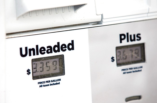 Gasoline prices are displayed at the pump at a convenience store in Bullhead City, Ariz., across the river from Laughlin, Nev., Tuesday, March 21, 2023. The price for regular gasoline is posted at $3.35 per gallon. In Laughlin, the price was $4.69 at a 76 gas station on Casino Drive.