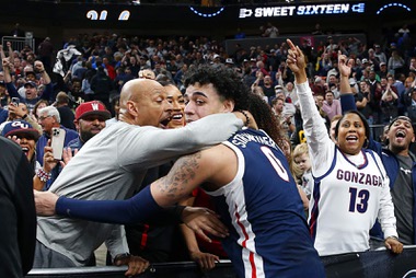 Gonzaga Bulldogs guard Julian Strawther (0) celebrates with his father Lee and sisters after Gonzagas 79-76 victory over UCLA in a Sweet Sixteen NCAA Tournament basketball game at T-Mobile Arena Thursday, March 23, 2023.